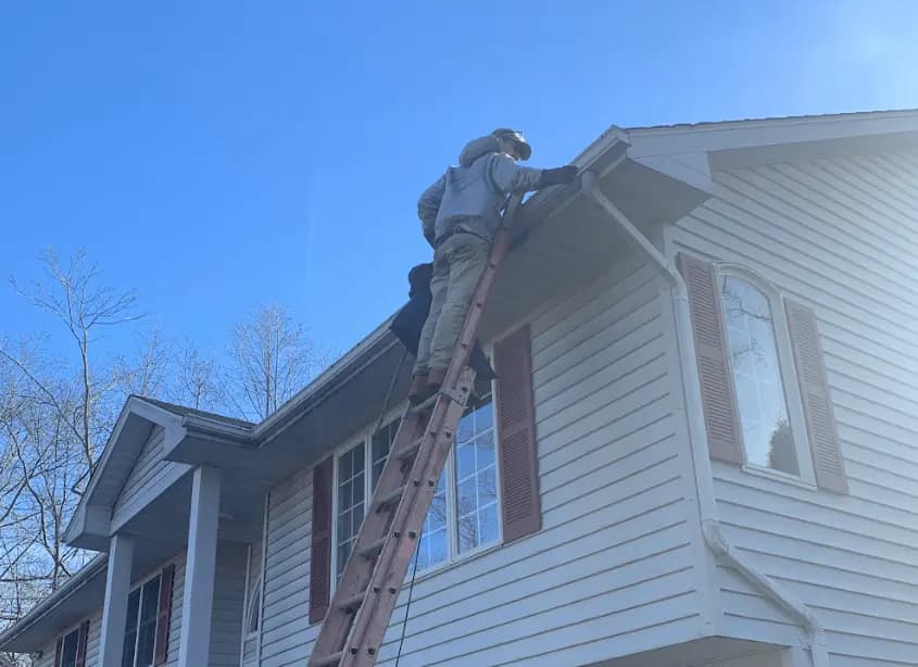 Gutter cleaning and maintenance being performed by Fairview Park Power Washing in Fairview Park